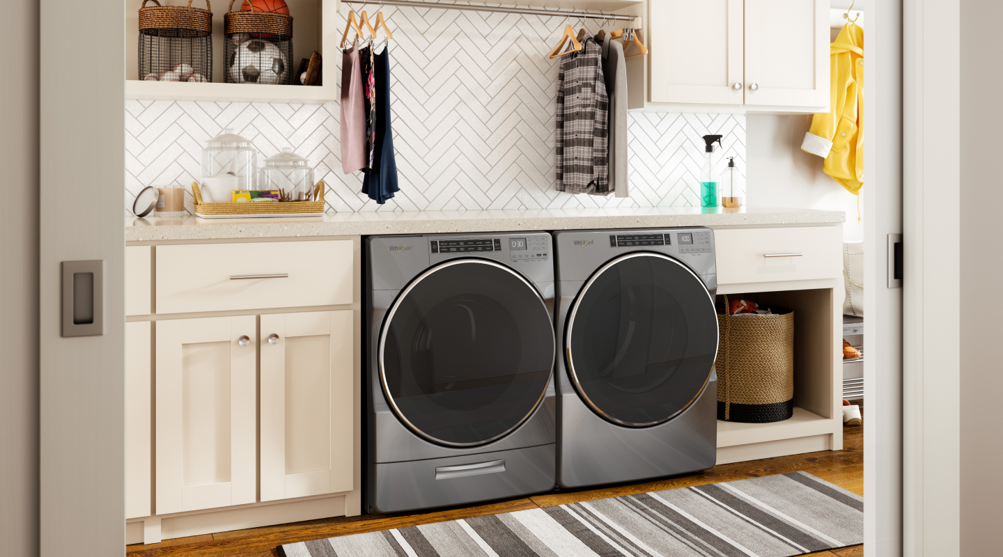 Stainless steel Whirlpool® washer and dryer set in laundry room Stainless steel Whirlpool® washer and dryer set in laundry room