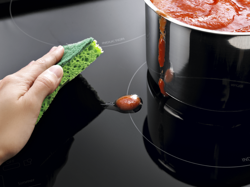 Removing spills from the stove top Removing spills from the stove top