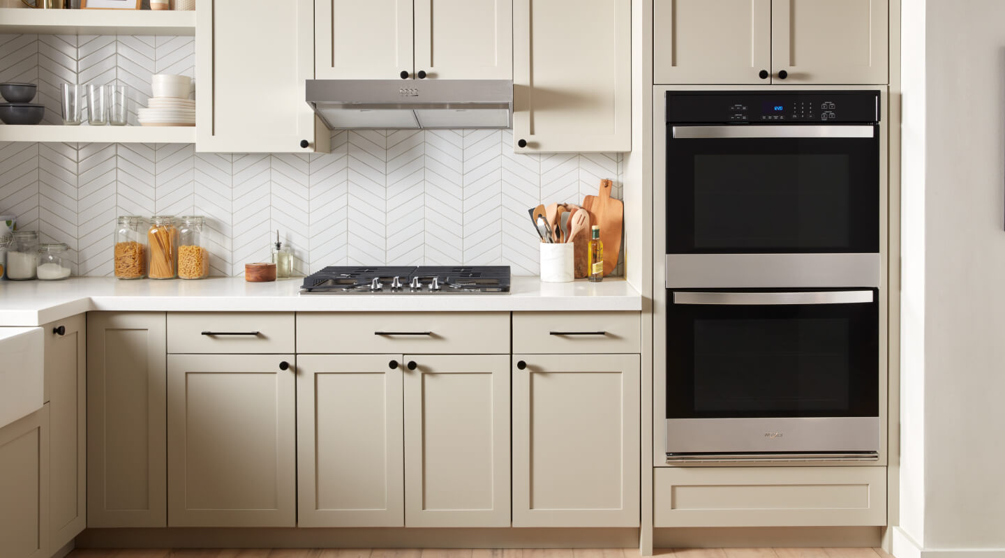A kitchen with a double wall oven