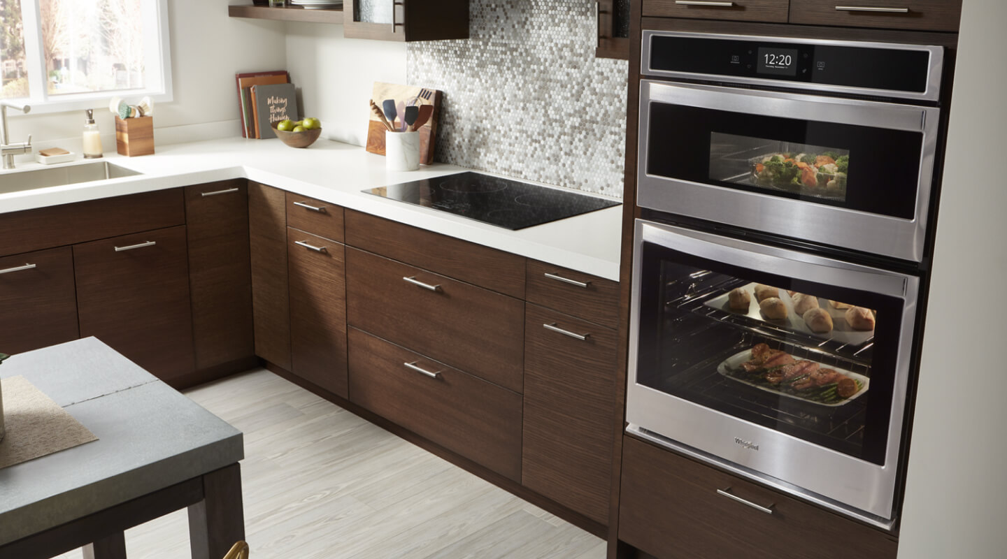 An oven with baking dishes of food inside An oven with baking dishes of food inside