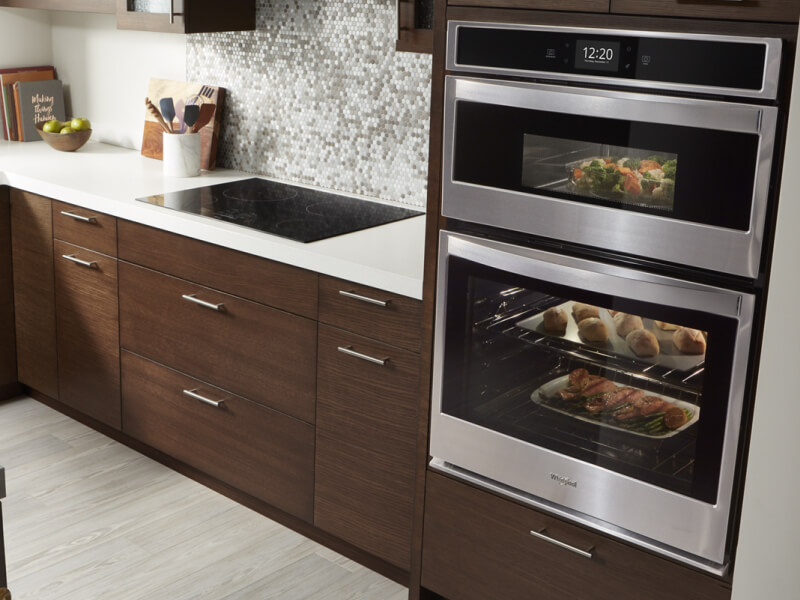 An oven with baking dishes of food inside An oven with baking dishes of food inside