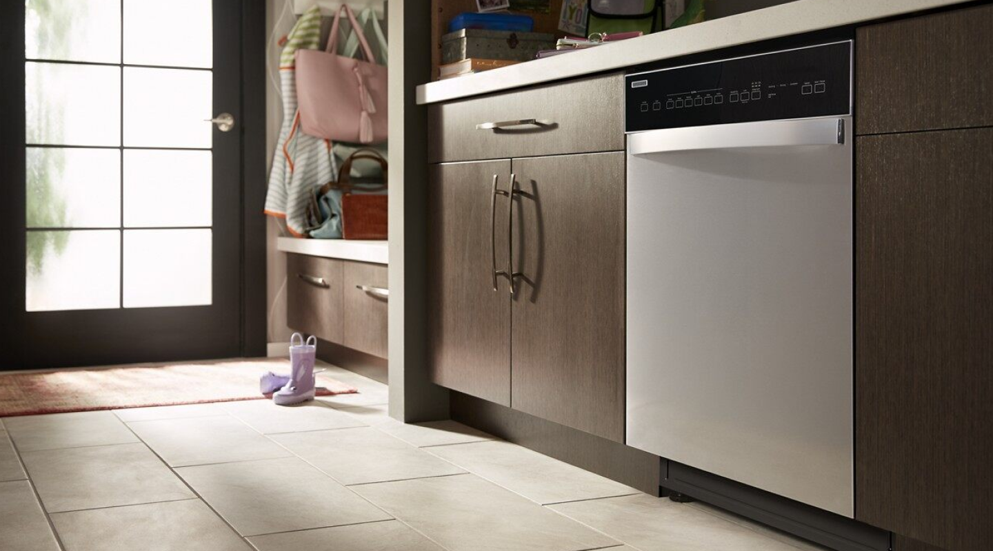 Stainless steel Whirlpool® Dishwasher in brown cabinetry