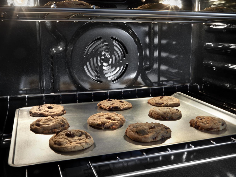 Chocolate chip cookies baking in an oven Chocolate chip cookies baking in an oven