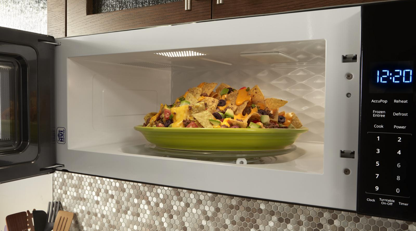 Plate of nachos inside a built-in microwave Plate of nachos inside a built-in microwave