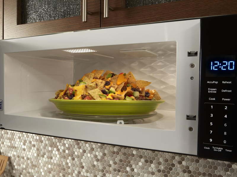 Plate of nachos inside a built-in microwave Plate of nachos inside a built-in microwave