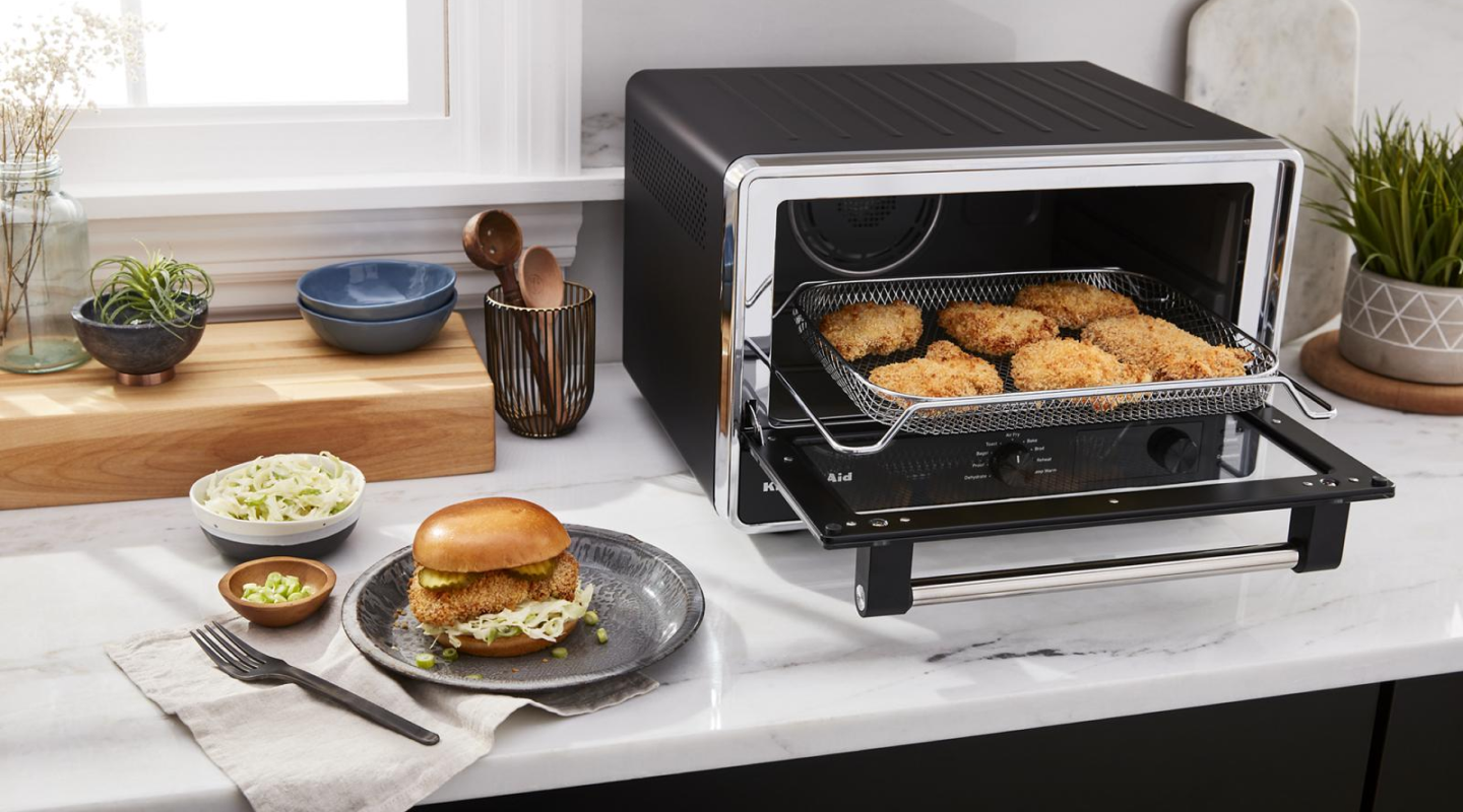 Breaded chicken inside a toaster oven Breaded chicken inside a toaster oven