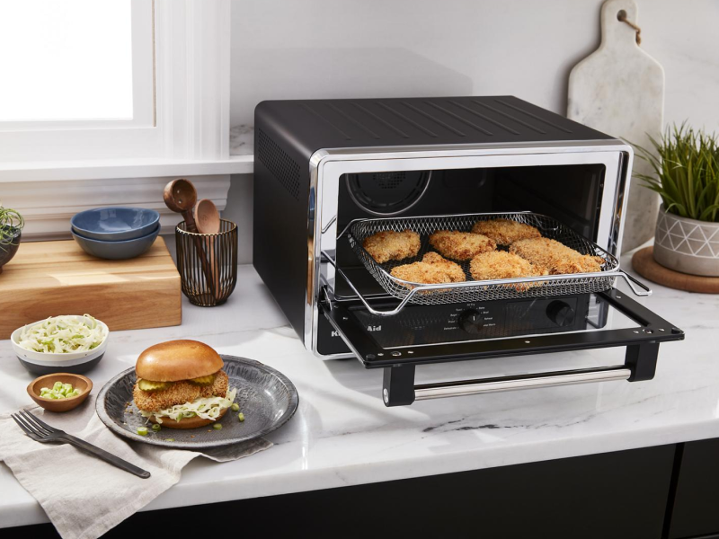Breaded chicken inside a toaster oven Breaded chicken inside a toaster oven