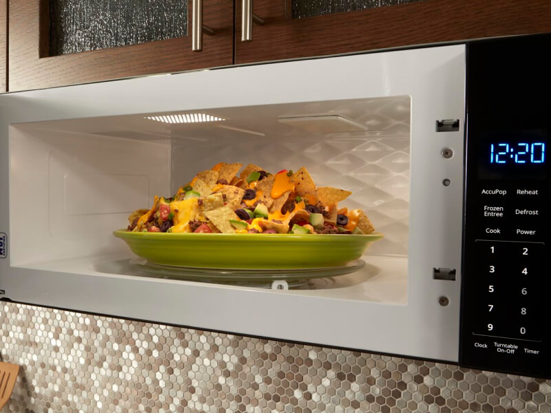Plate of nachos inside a built-in microwave