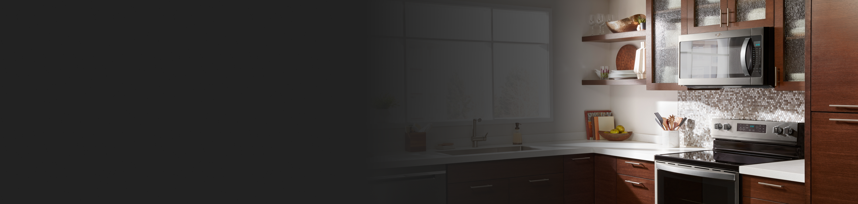 Wood cabinets and kitchen counter with microwave and oven