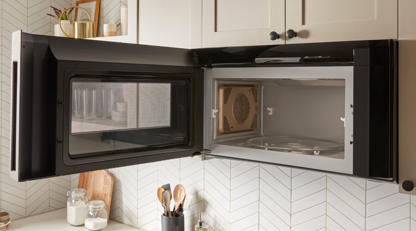 Over-the-range microwave with an open door Over-the-range microwave with an open door