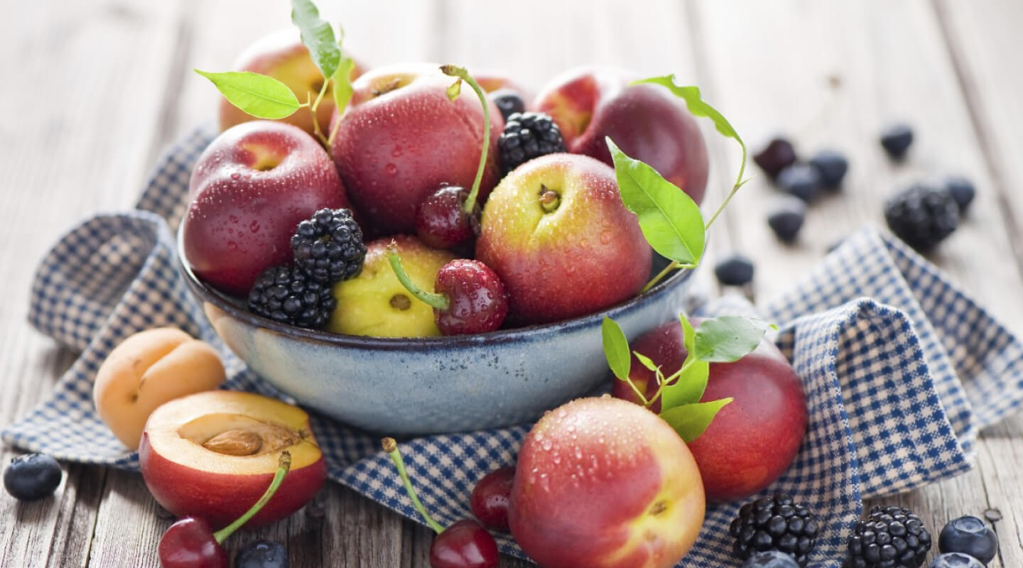 A bowl of peaches, cherries and blackberries A bowl of peaches, cherries and blackberries