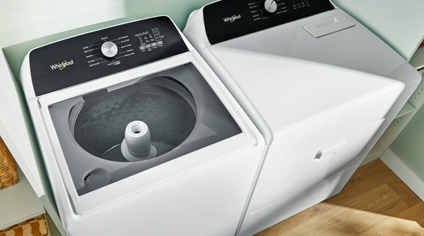 A white Whirlpool® Top Load Washer and Dryer set