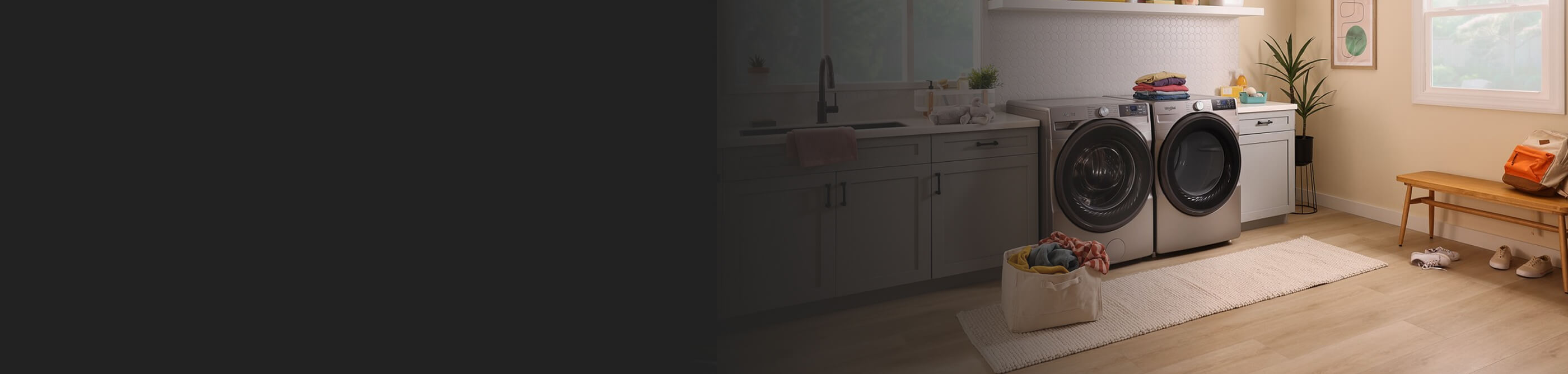Whirlpool® Washer and Dryer in a large laundry room