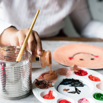 A child painting with acrylics