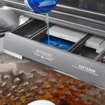 Laundry detergent poured into the washer's dispenser compartment