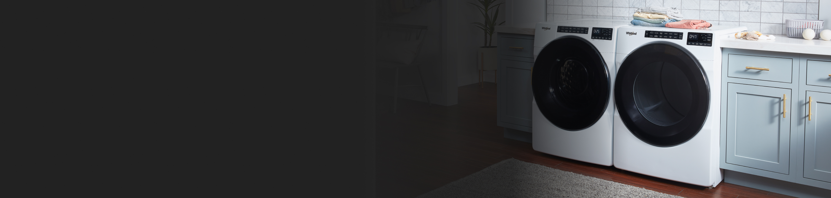 White front-load washer and dryer in a laundry room