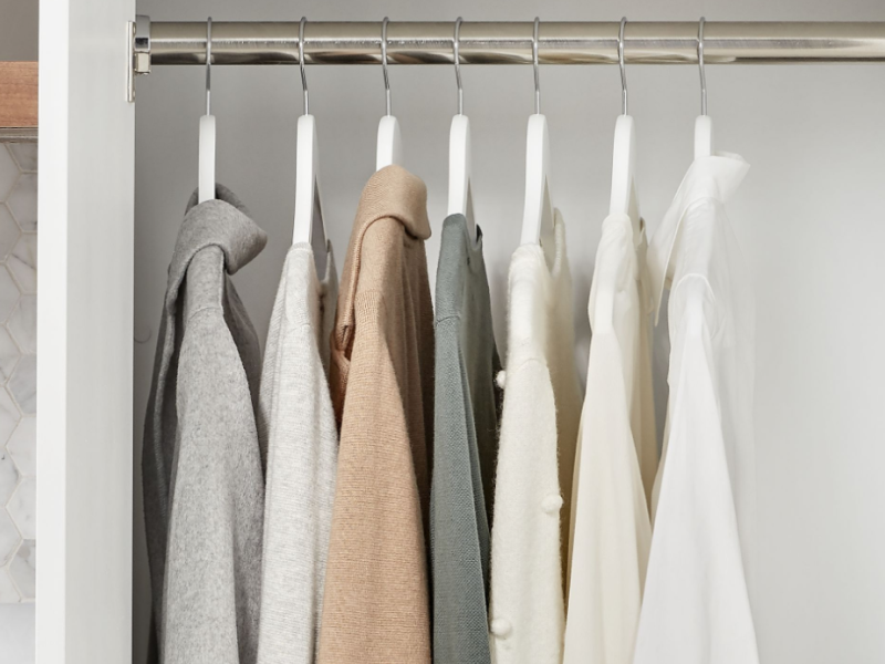 Clothing hung inside a closet Clothing hung inside a closet