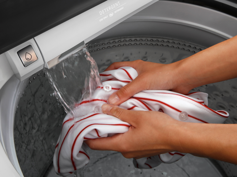Hands pretreating clothing with built-in water faucet Hands pretreating clothing with built-in water faucet