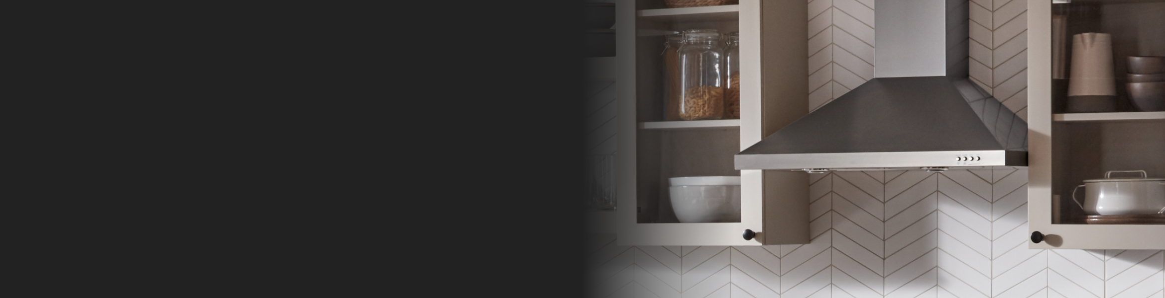 Range hood between white cabinets