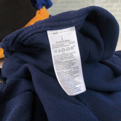 Clothing care label on a blue shirt