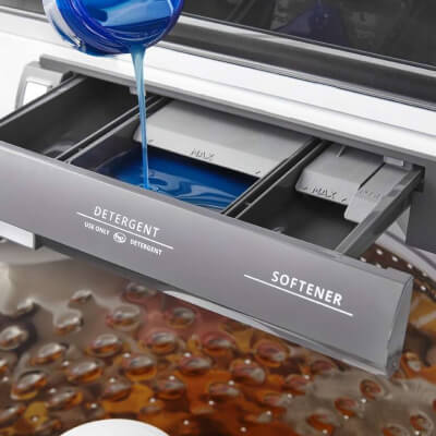 Small amount of detergent being added to washer