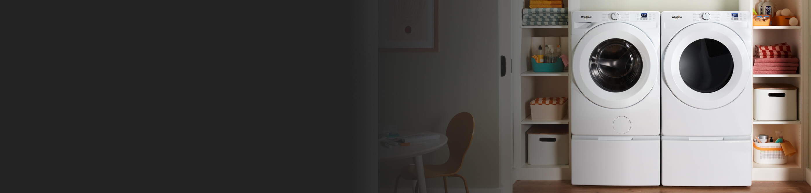 A white Whirlpool Front Load Washer & Dryer pair in a laundry closet with shelves of laundry supplies