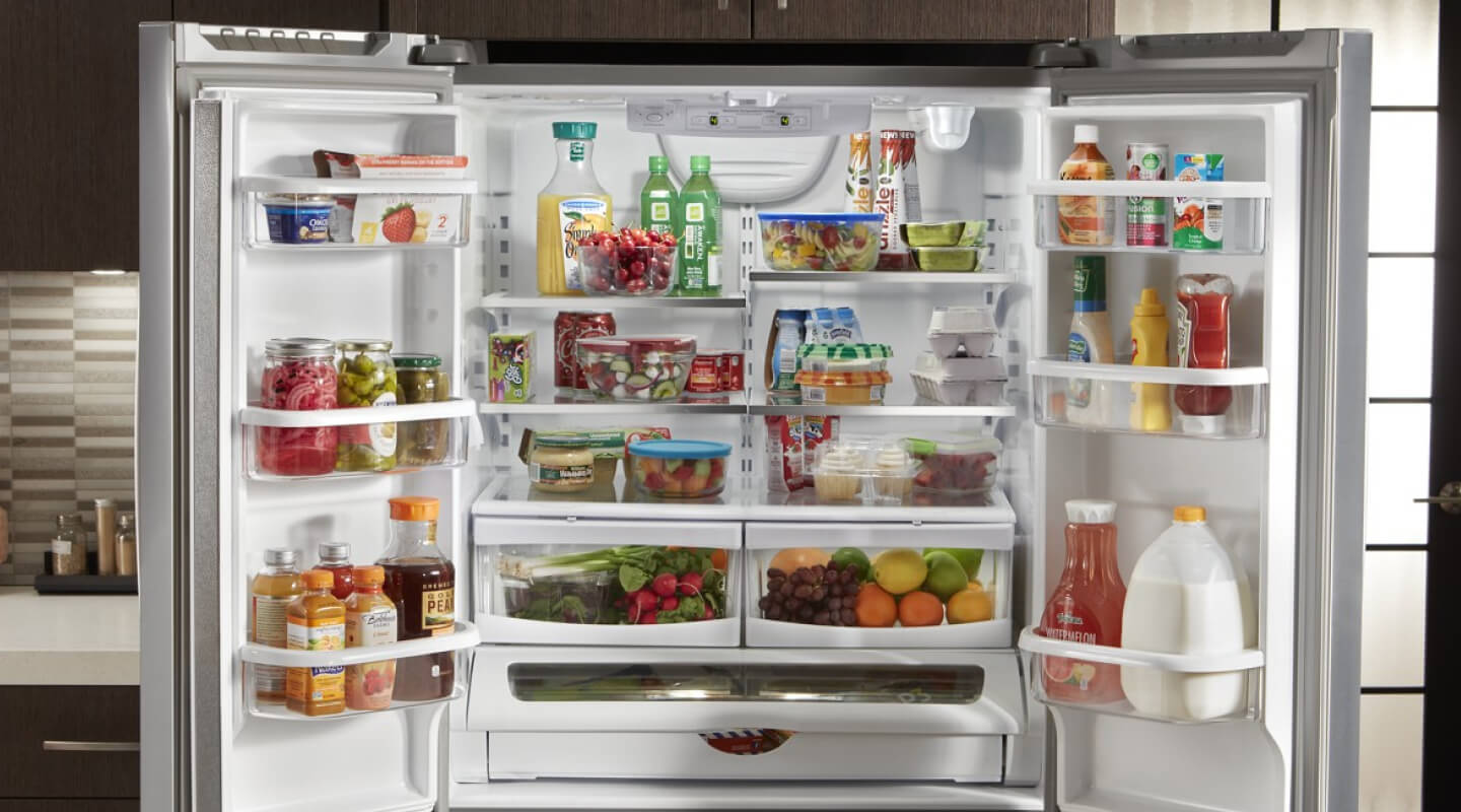 Both doors open, showing the inside of a Whirlpool® Refrigerator Both doors open, showing the inside of a Whirlpool® Refrigerator