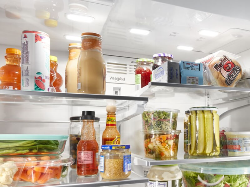 Shelves full of food inside a Whirlpool® Refrigerator Shelves full of food inside a Whirlpool® Refrigerator