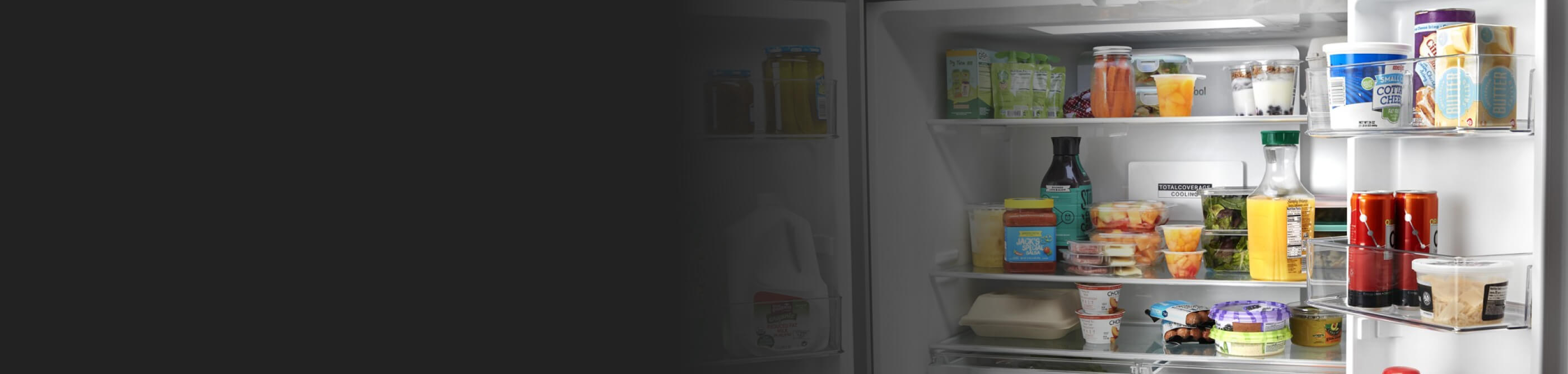 An open, stocked Whirlpool® Refrigerator