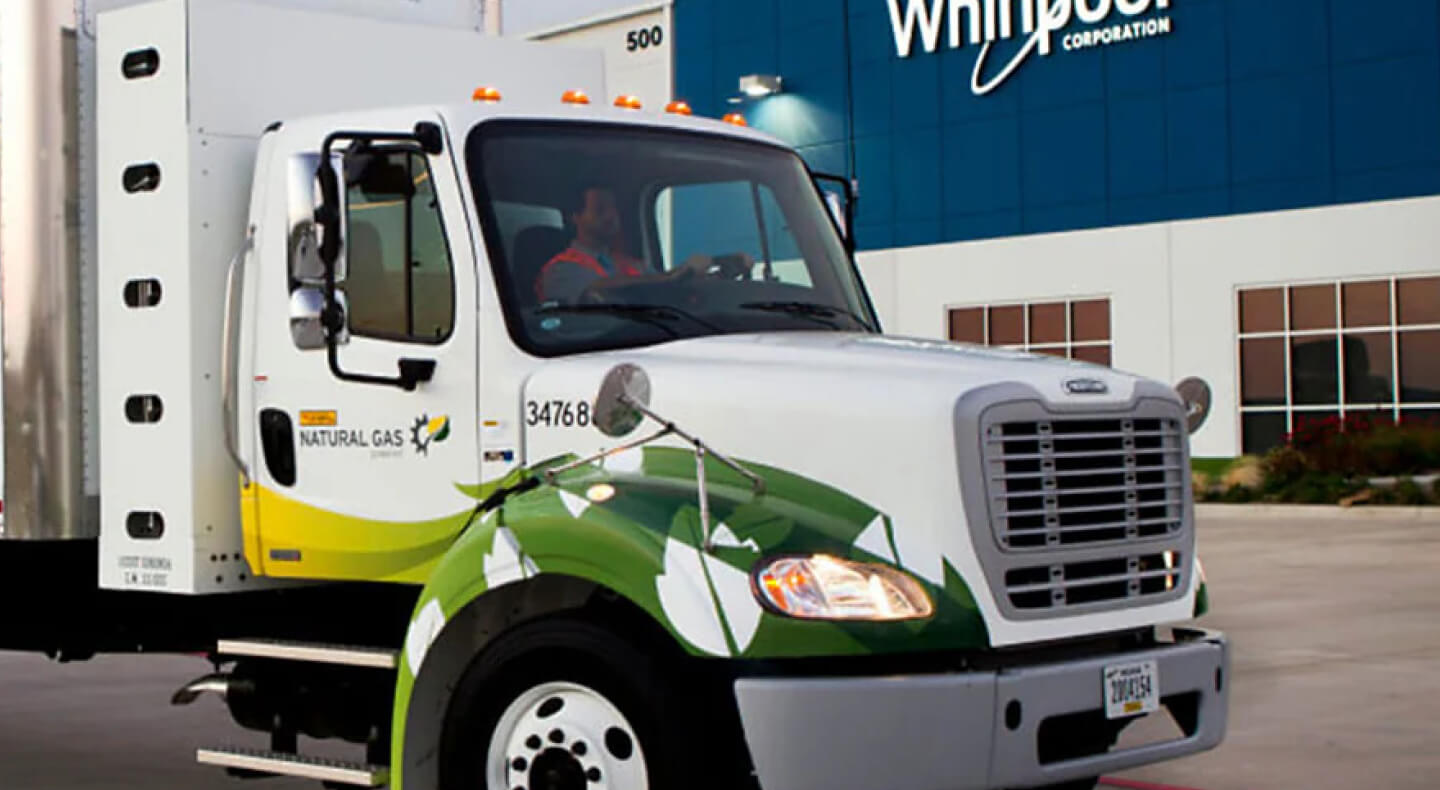 Front cab of semi truck in front of a Whirlpool Corporation building Front cab of semi truck in front of a Whirlpool Corporation building
