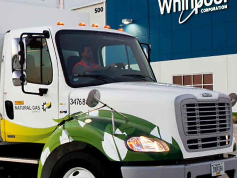 Front cab of semi truck in front of a Whirlpool Corporation building Front cab of semi truck in front of a Whirlpool Corporation building