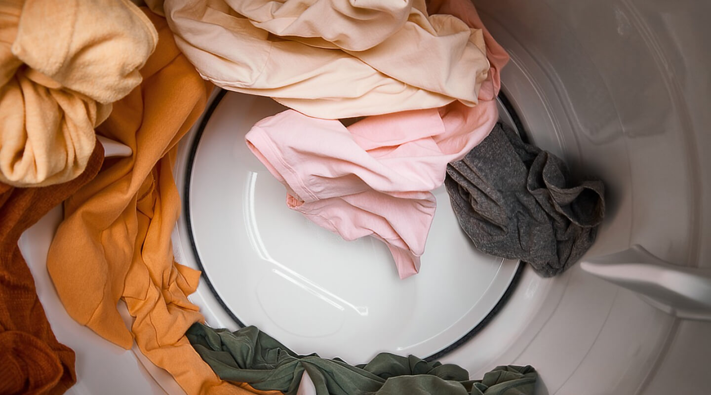Clothes moving through a dryer