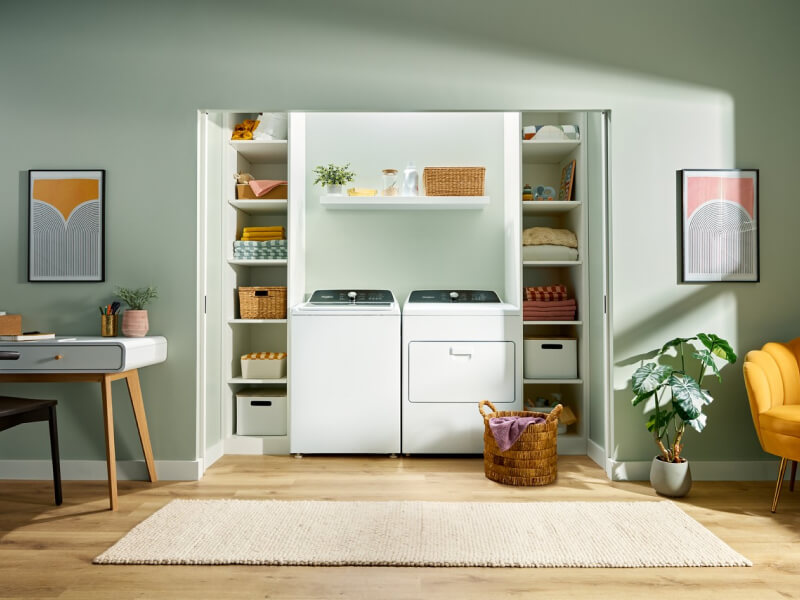 Laundry room with a white Whirlpool® Top Load Laundry Set