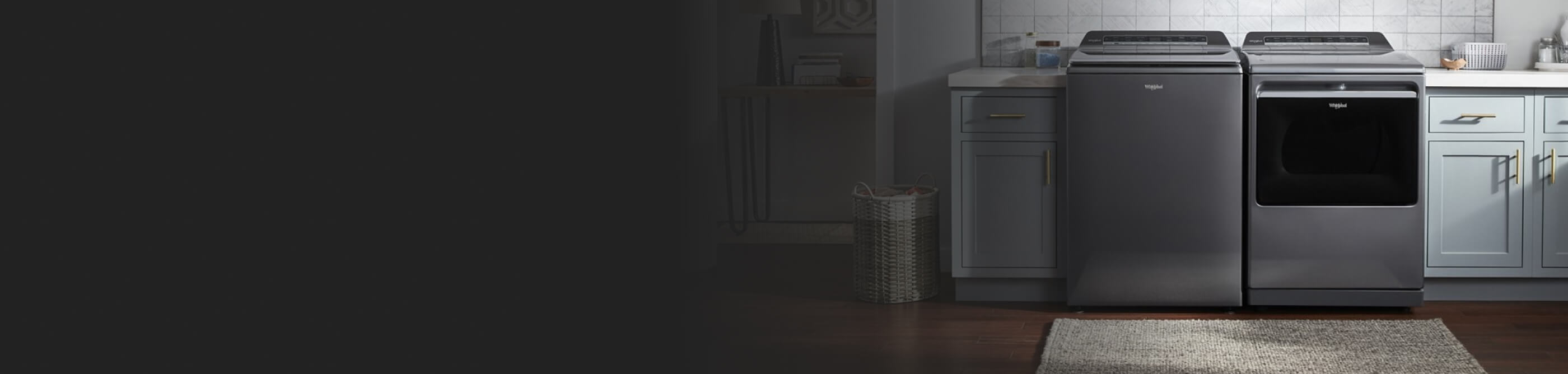 A grey Whirlpool® Top Load Washer and Dryer set