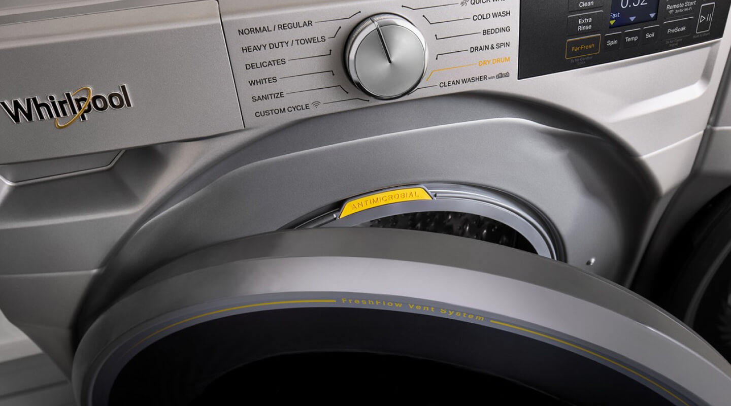 Close up of a front load washer with the door slightly open Close up of a front load washer with the door slightly open