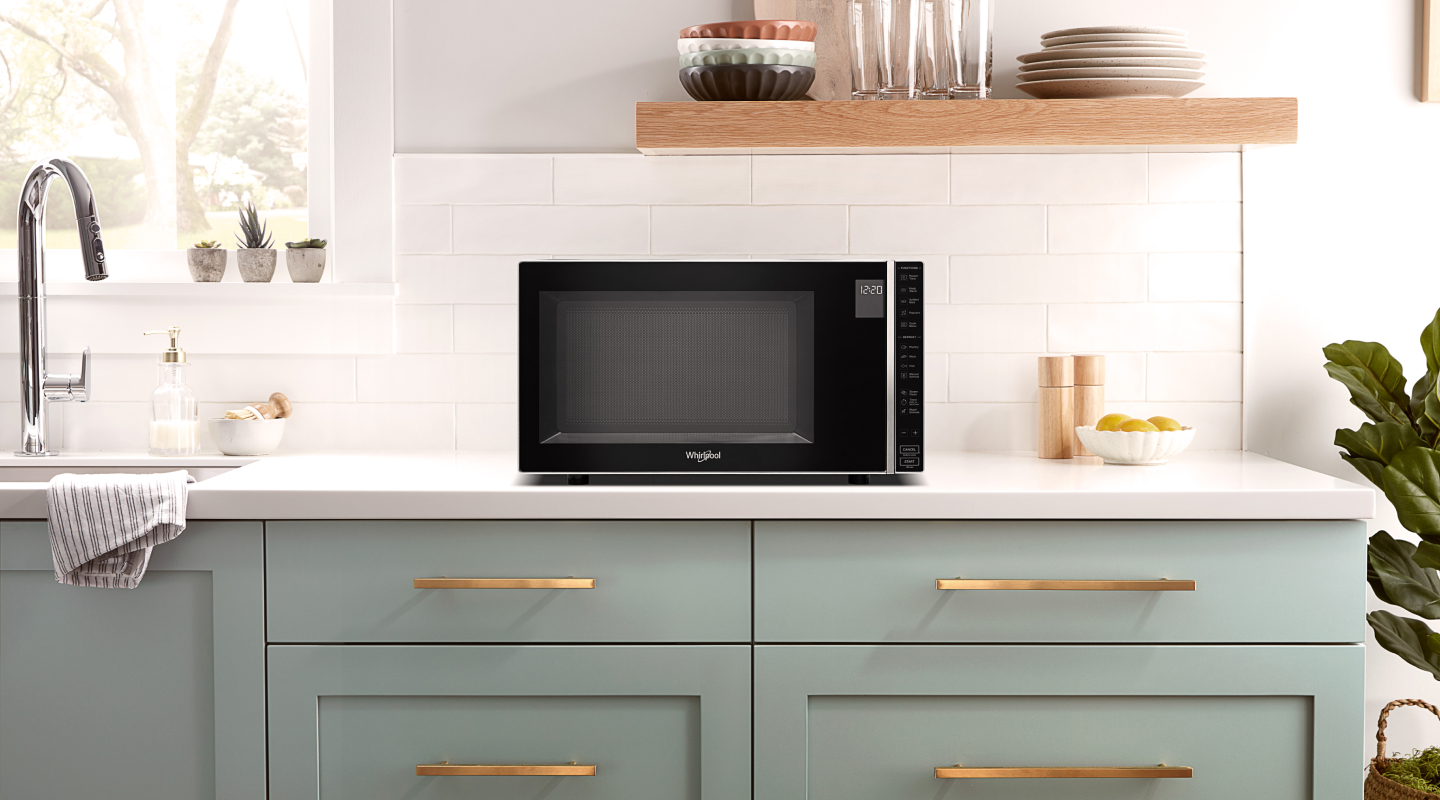 Microwave on top of kitchen counter