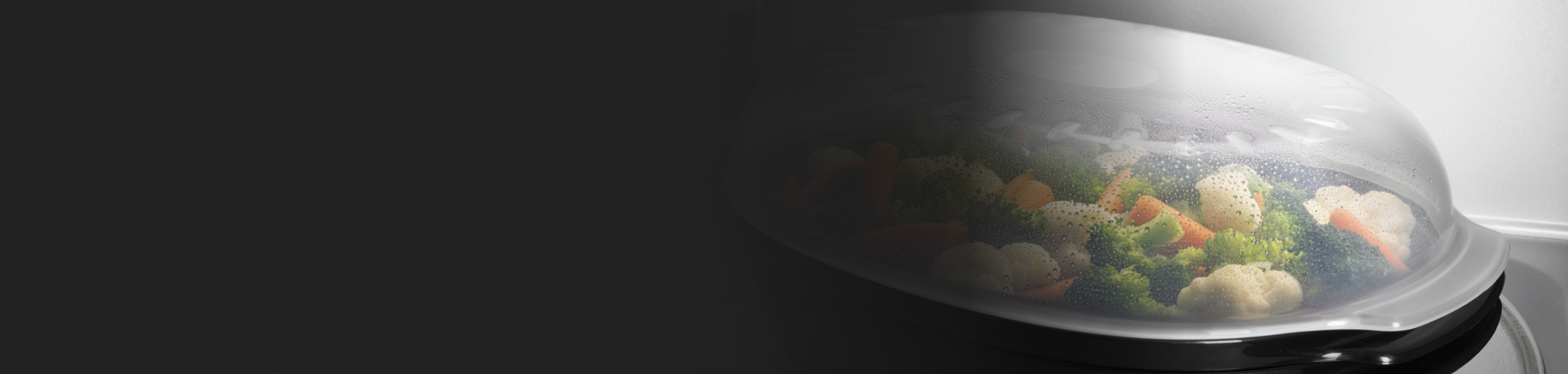 Vegetables steaming inside a microwave