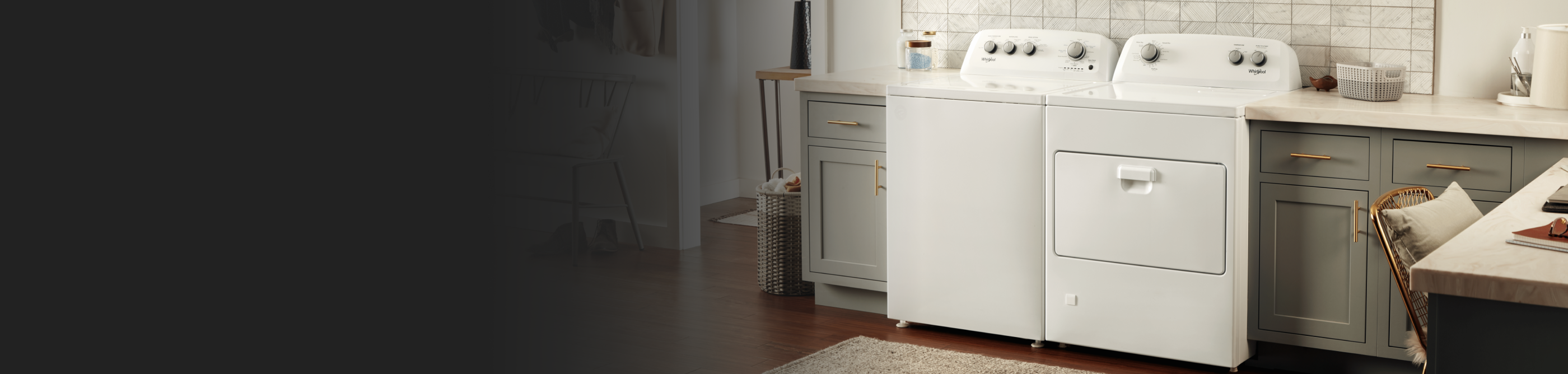 A white Whirlpool® washer and dryer pair in a laundry room