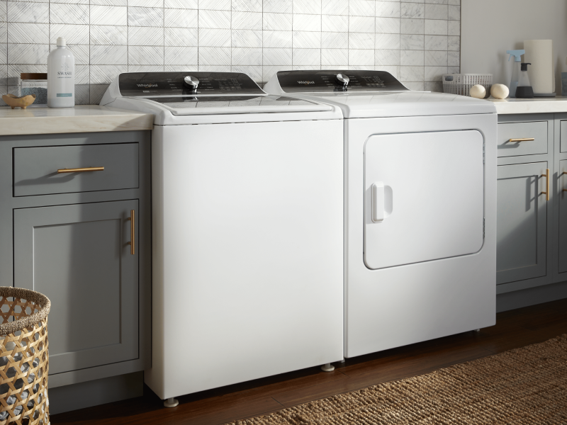 A white Whirlpool® washer and dryer pair in a modern laundry room A white Whirlpool® washer and dryer pair in a modern laundry room