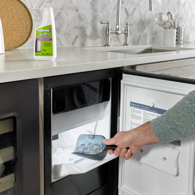 Person scooping ice out of an icemaker