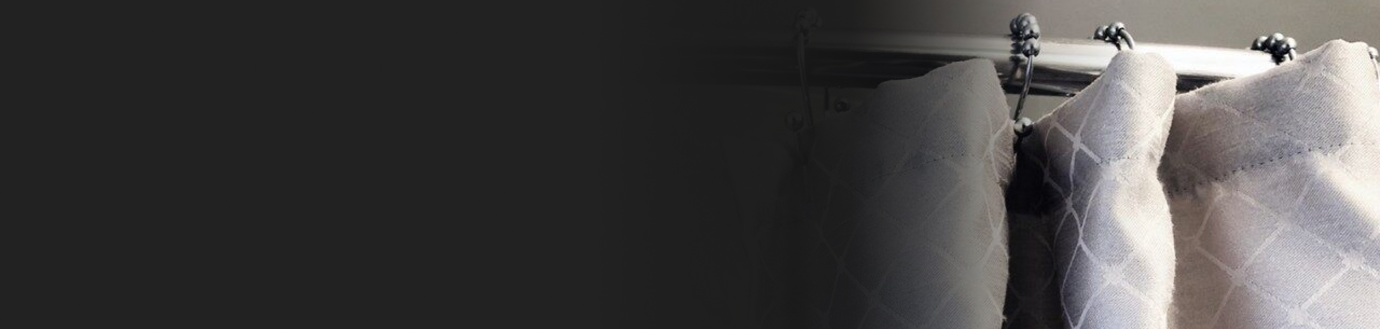 A gray and white shower curtain.