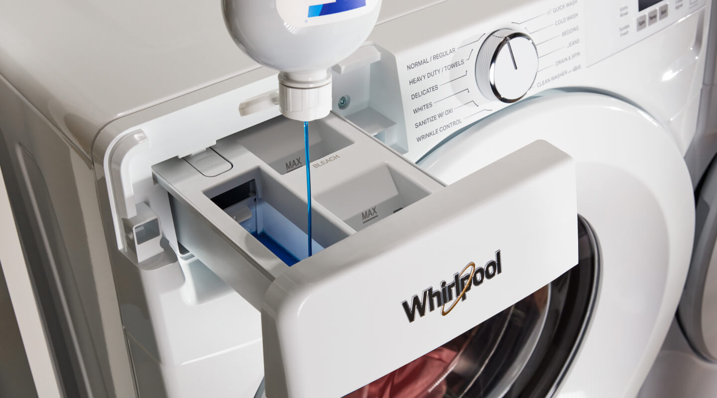 Detergent poured into a Whirlpool® washer.