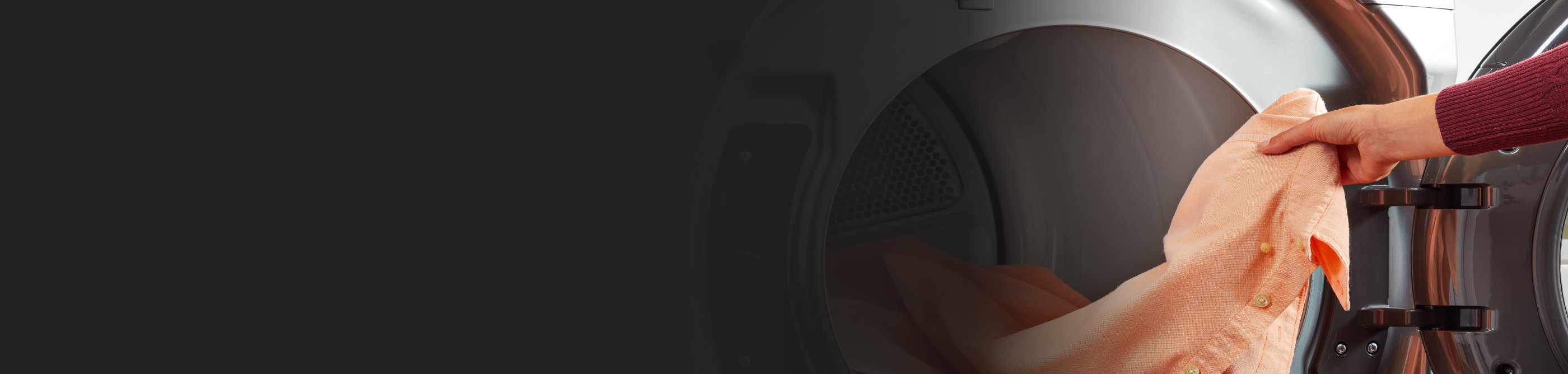 Person removing dress shirt from dryer