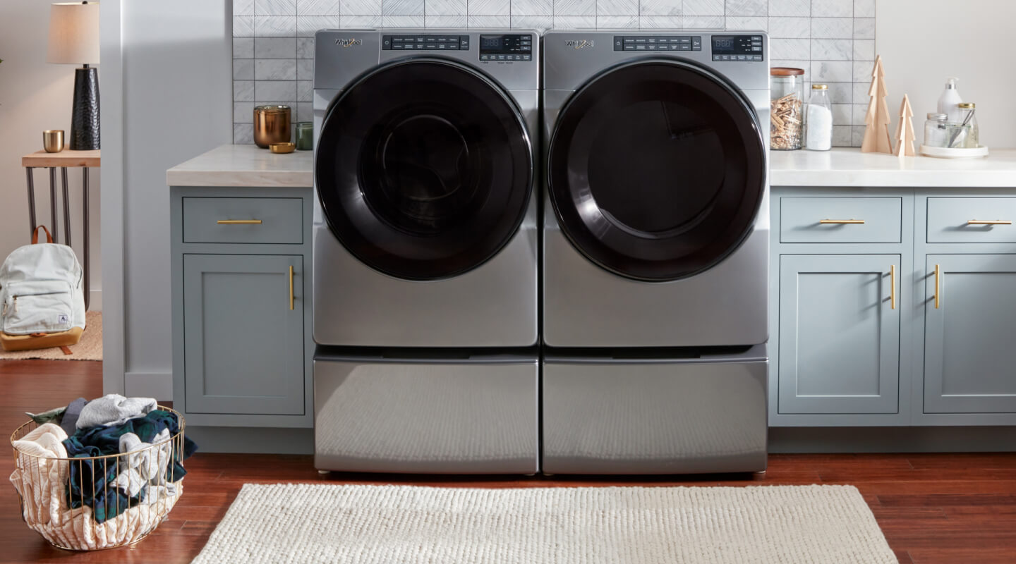 A Whirlpool® washer and dryer pair in a laundry room