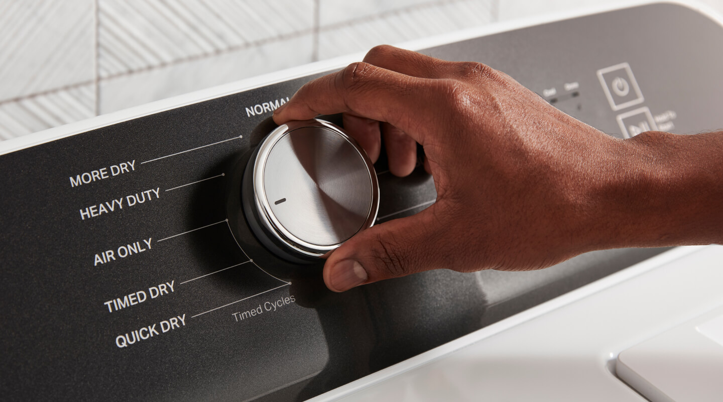 A person selecting Air Only dry on a dryer
