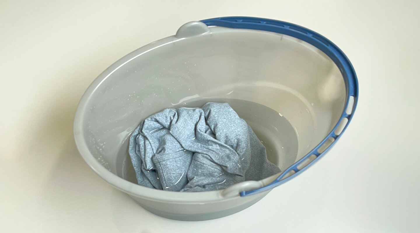 Leggings soaking in a bucket of water