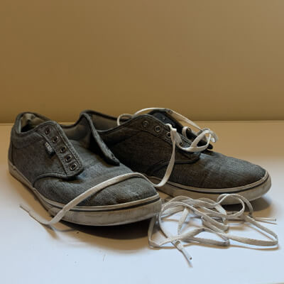 Dirty shoes with shoe laces removed