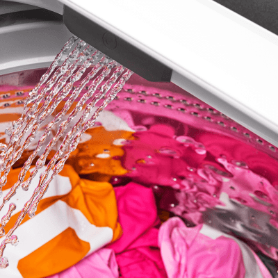 Clothing getting rinsed in a washing machine