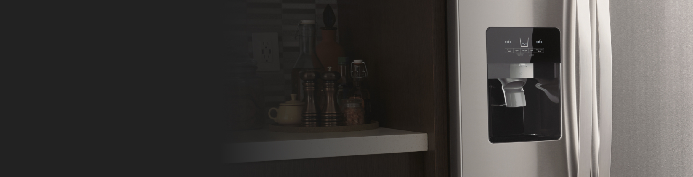 Close up of silver refrigerator ice maker chute