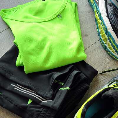 Neon gym gear folded on the floor
